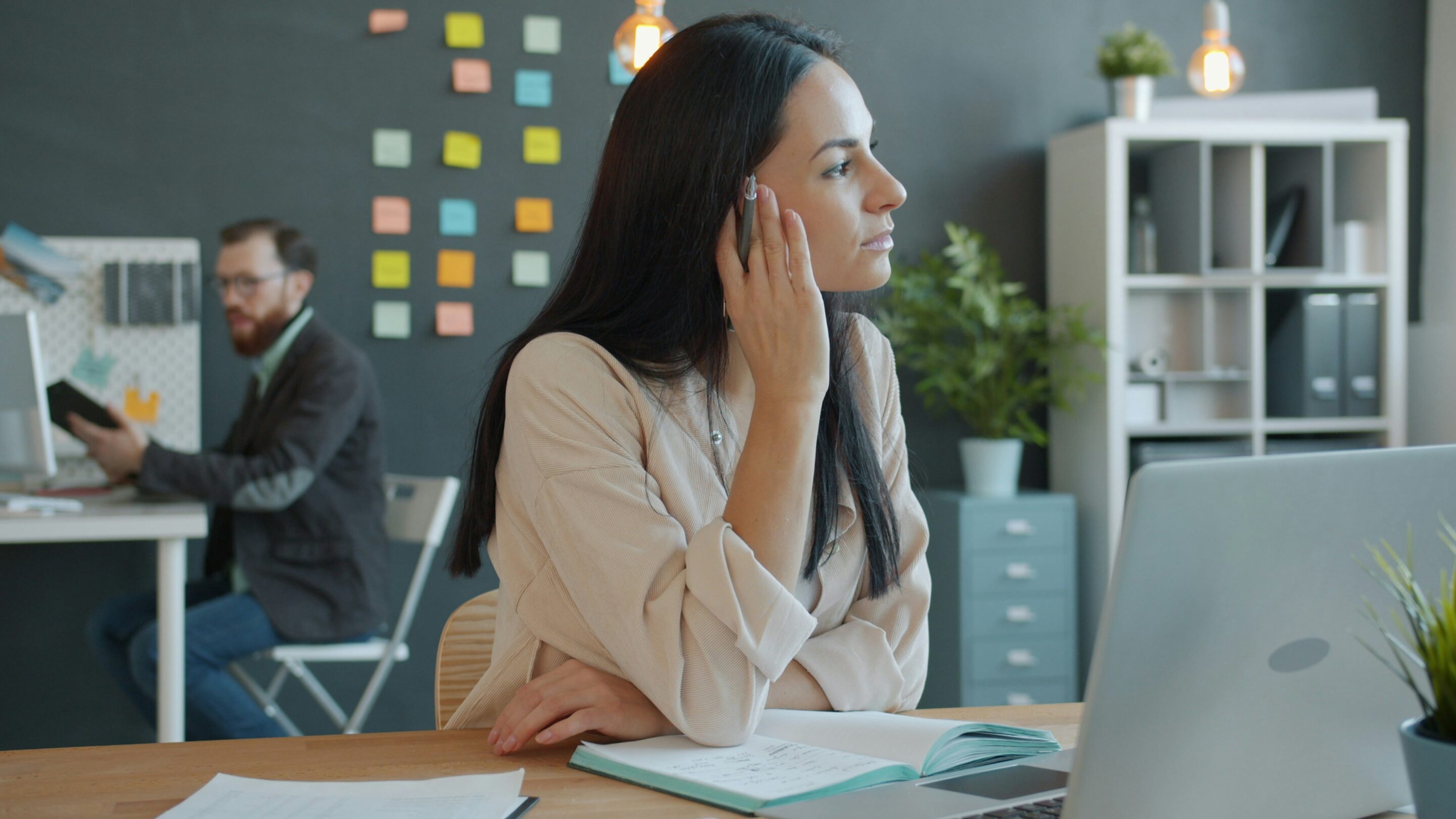 Woman looking thoughtful at her desk