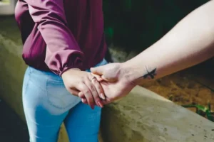 Couple holding hands