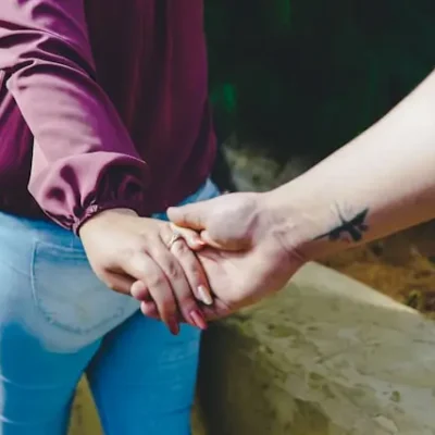 Couple holding hands